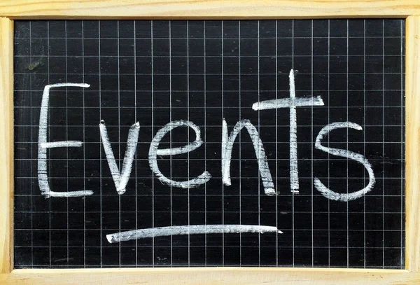 The word Events written in white chalk on a blackboard as a reminder — Stock Photo, Image