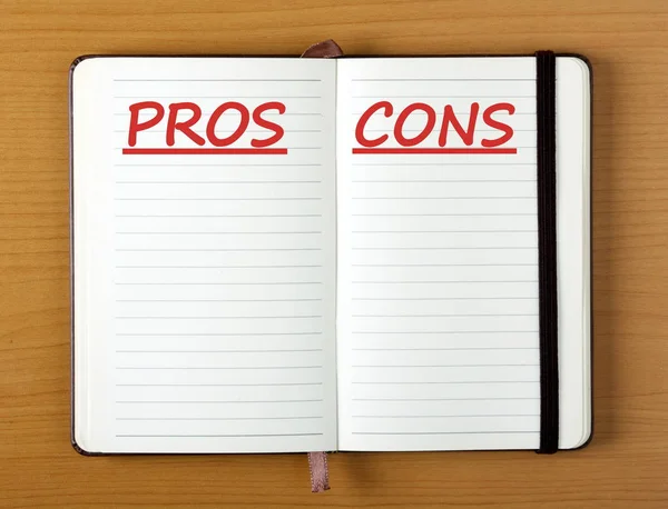 Listing Pros and Cons in a Notebook — Stock Photo, Image