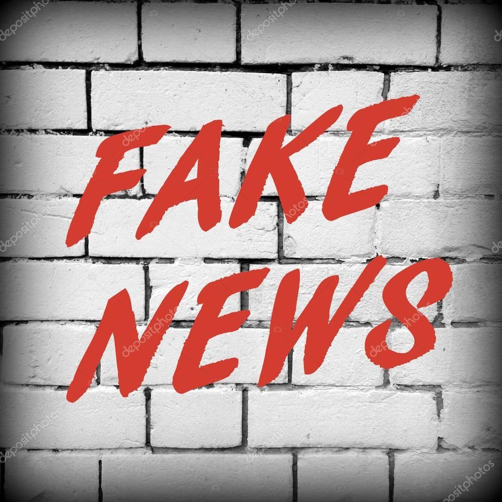 The words Fake News on a brick wall