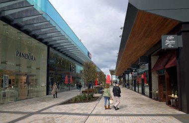 Bracknell, England - April 23, 2018: Wide Angle view of shops and pedestrians in the new Lexicon shopping centre in Bracknell, England clipart