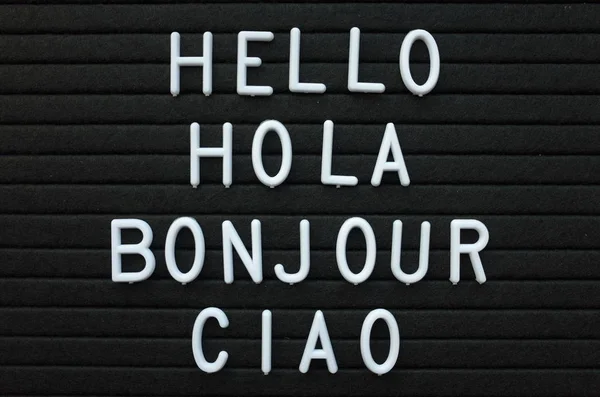 Words Hello Hola Bonjour Ciao White Plastic Letters Black Letter — Stock Photo, Image