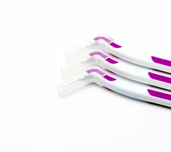 Three interdental brush with cover isolated on white background with copy space — Stock Photo, Image