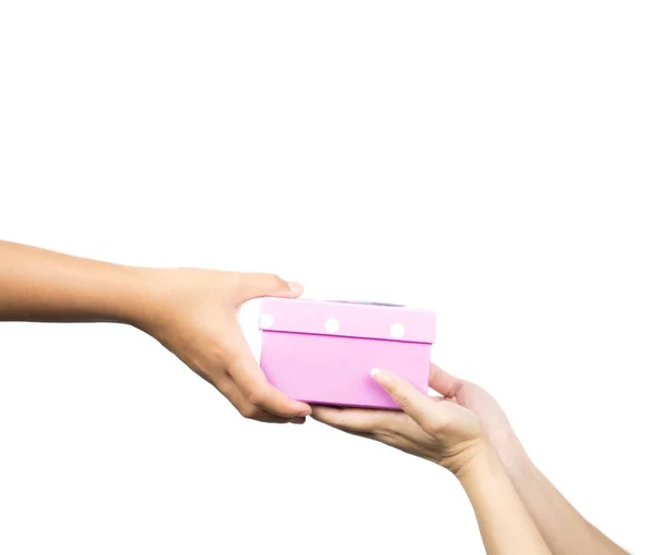 Closeup hands giving and receiving pink gift box isolated on white background — Stock Photo, Image