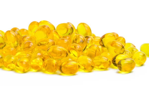 Pile of cod liver oil isolated on white background. Source of Omega-3 and vitamin A & D helps growth development and absorption of calcium and phosphorous in the body — Stock Photo, Image