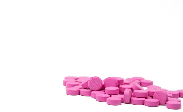 Pile of pink tablets pills isolated on white background with clipping path. Copy space — Stock Photo, Image