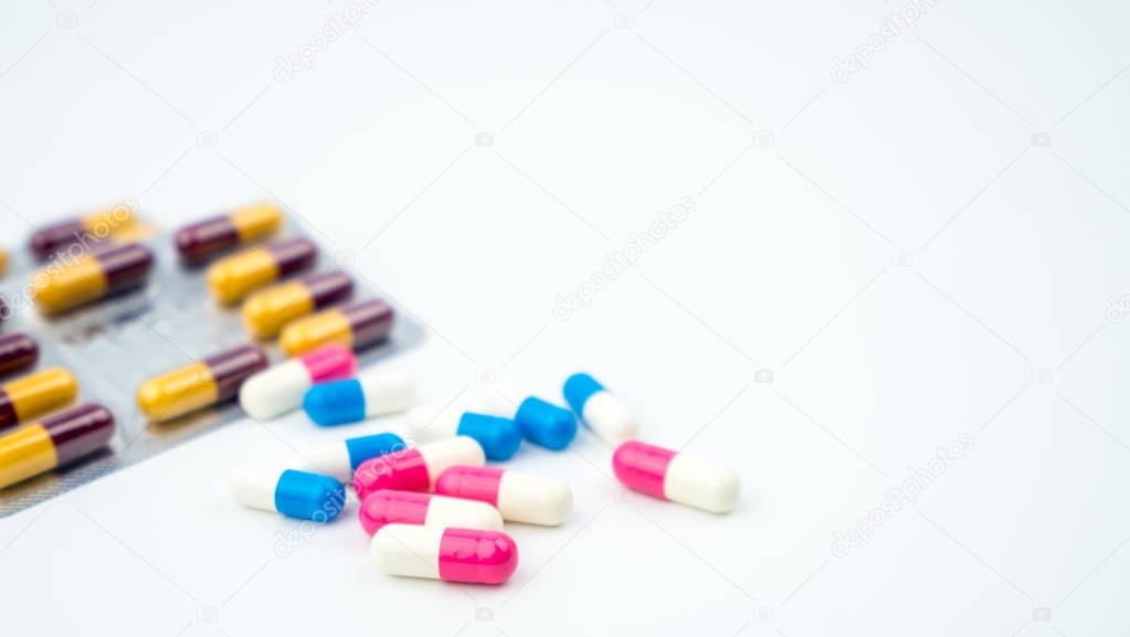Colorful of antibiotic capsules pills on blurred background with copy space. Drug resistance, antibiotic drug use with reasonable, health policy and health insurance concept.