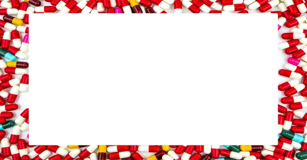 Colorful of antibiotics capsule pills rectangle frame on white background with copy space. Drug resistance concept. Antibiotics drug use with reasonable and global healthcare concept. — Stock Photo, Image