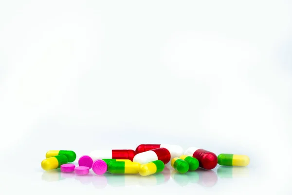 Pile of colorful capsule and tablets pills on white background with copy space for text. Pharmacy department in the hospital concept. Drug store concept. — Stock Photo, Image