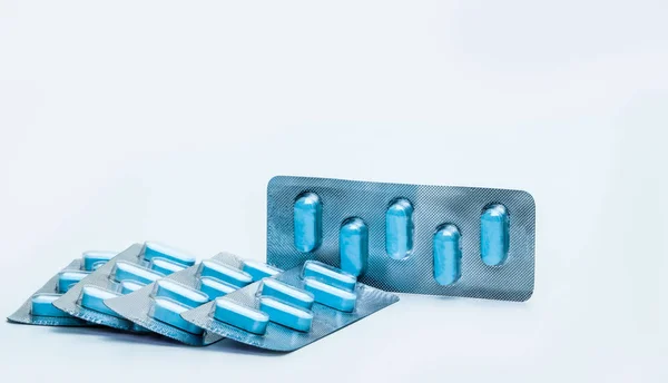 Macro shot of tablets pills in blister packs on white background. Five packs of antiviral medicine for treatment herpes viral infection. 5-day course of antivirals. Herpes virus concept. — Stock Photo, Image