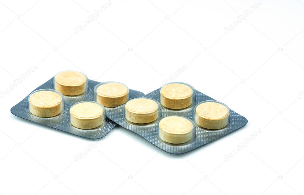 Anthelmintic tablets pills in blister packs on white background with copy space. Set of four tablets pills : niclosamide and phenolphthalein for treatment tapeworm. Chewable tablet pills. 
