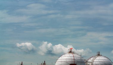 Industrial gas storage tank. LNG or liquefied natural gas storage tank. Spherical gas tank in petroleum refinery. Above-ground storage tank. Natural gas storage industry and global market consumption  clipart