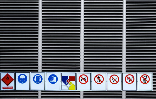 Warning sign chemical storage area installed at chemical storage room wall of factory. Safety sign in manufacturing industry. Industrial gas stored area. Chemical storage area keep out sign.  