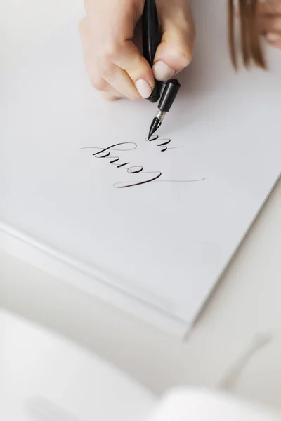 Close up photo of woman hands holding pen and writing  beautiful postcard isolated — Stock Photo, Image