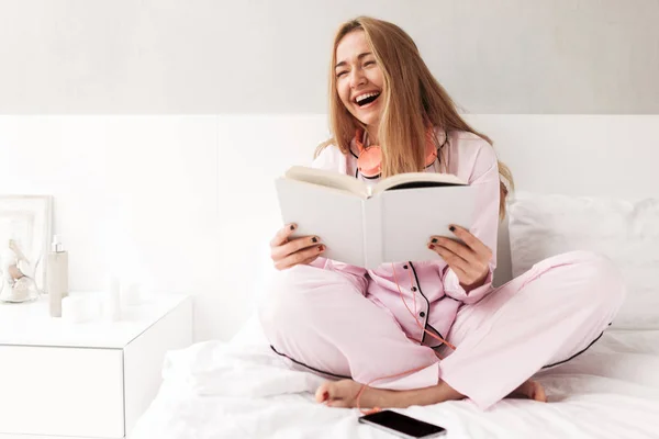 Portrait Happy Lady Sitting Bed Book Hands Laughing Home Isolated — Stock Photo, Image