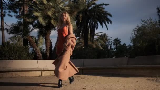 Attractive Romantic Blond Girl Coat Silk Dress Dreamily Whirling Street — Stock Video