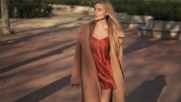 Tracking Shot Gorgeous Romantic Blond Girl Red Silk Dress Walking — Stock Video