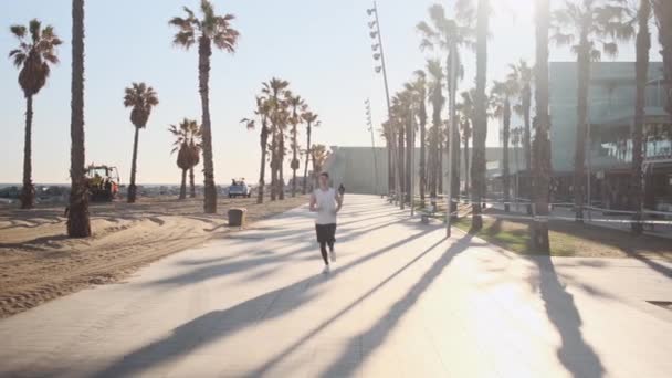Tracking Shot Young Attractive Sporty Man Running Morning Beautiful Seaside — Video
