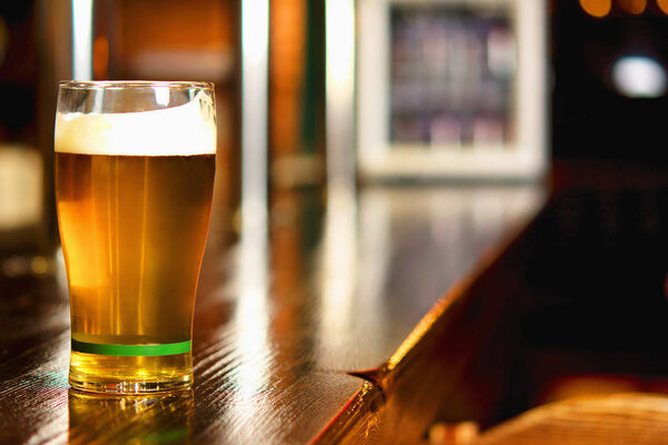 Pint of beer on a bar in a traditional style pub