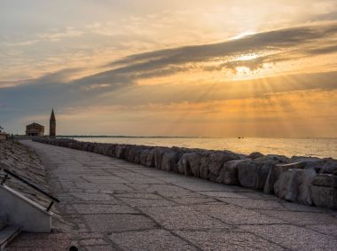 sunrise in Caorle Italy Caorle promenade, lighthouse