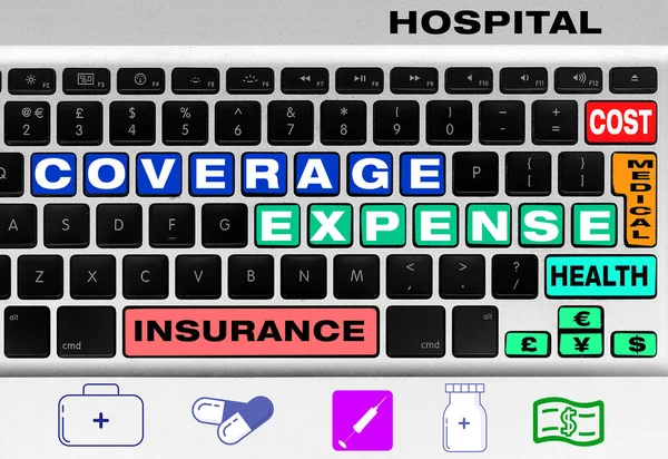 Concept of health insurance costs in colorful letters on computer keyboard