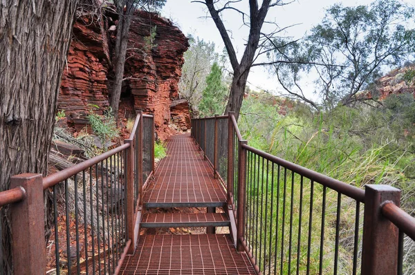 Metal bridge near red mountain — Stock Photo, Image