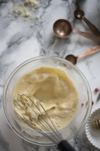 Eggs beating up with utility whisk — Stock Photo, Image