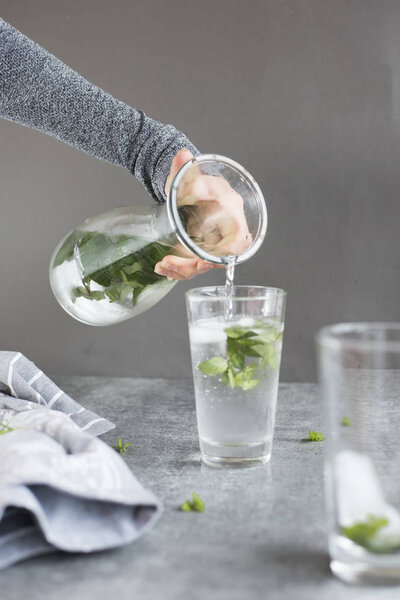 female hand pouring water