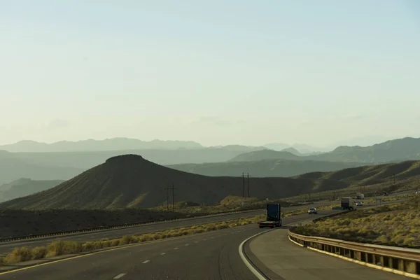 Cars on road with mountains — Stock Photo, Image