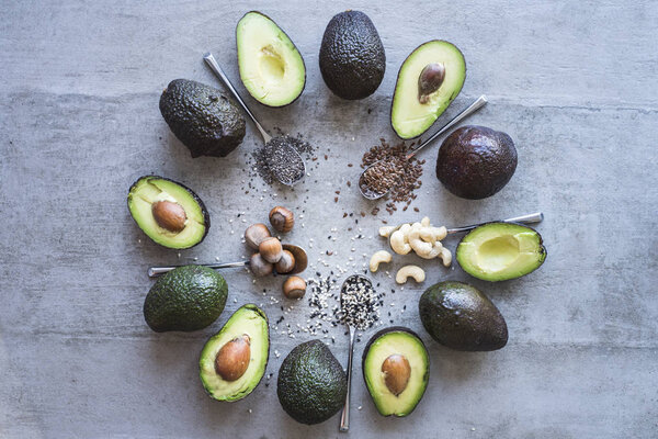 avocado halves with spices and nuts