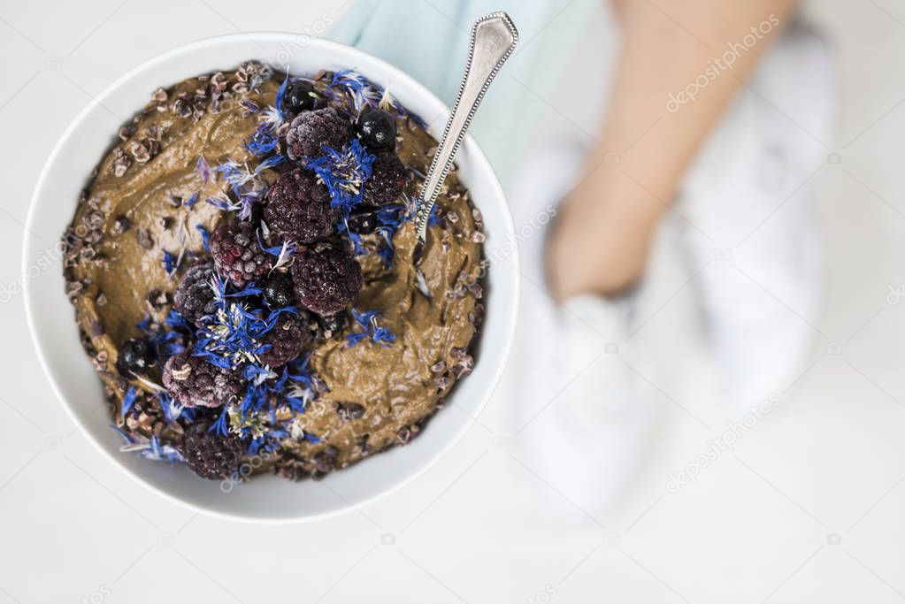 Woman holding smoothie bowl