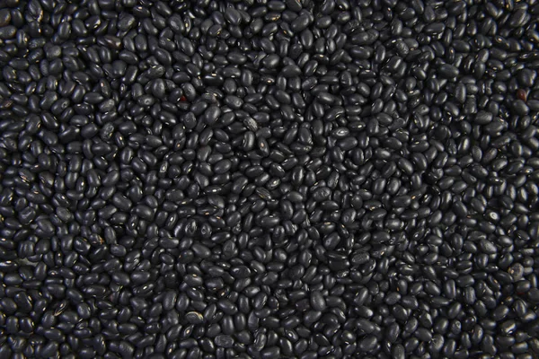 Seeds black beans useful for health texture background. — Stock Photo, Image