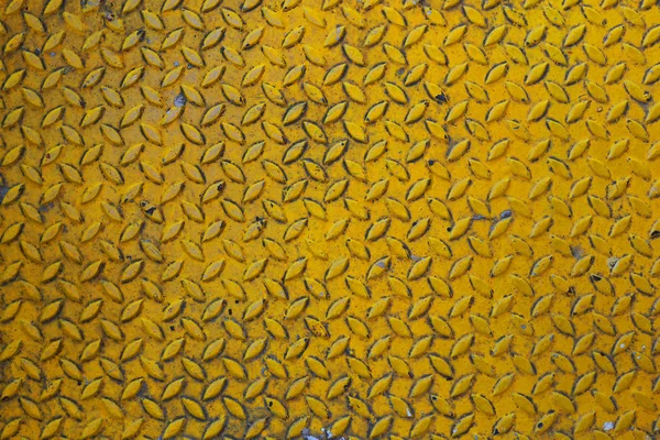 The old  yellow diamond steel metal sheet background.