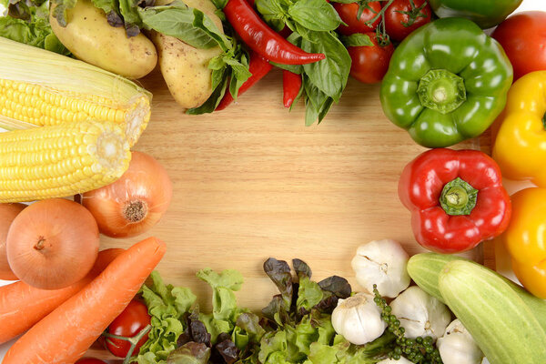 Different fresh organic vegetables for healthy on wood background.(clean eating dieting and healthy organic food concept)