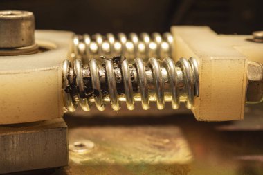Spring with shaft from a piece of mechanical equipment.