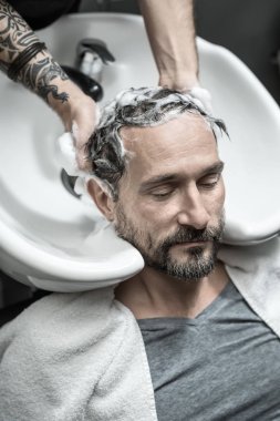 Washing head in barbershop clipart