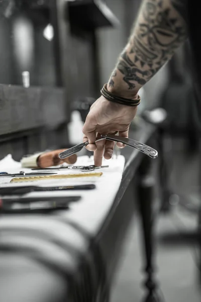 Hand with straight blade — Stock Photo, Image