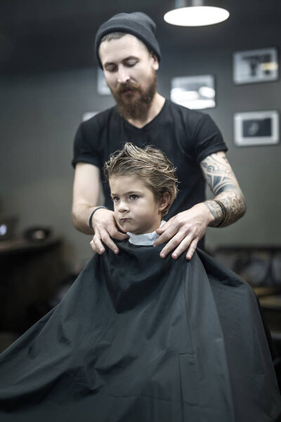 Little kid in barbershop