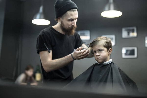 Kids hair styling in barbershop