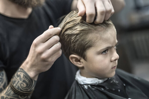 Kids hair styling in barbershop