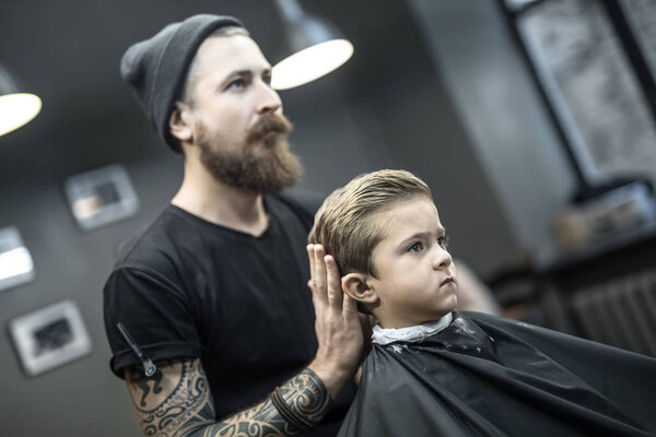 Kids hair styling in barbershop