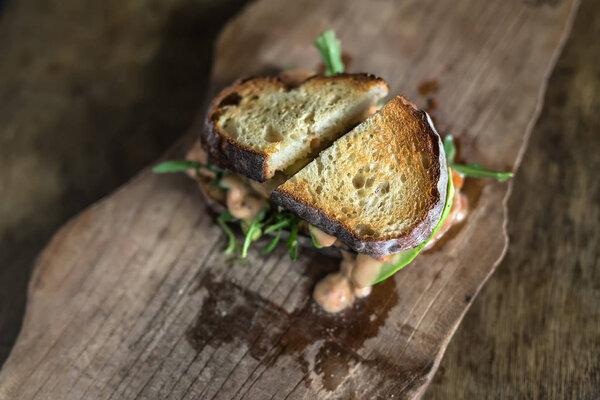 Roasted sandwich on wooden board