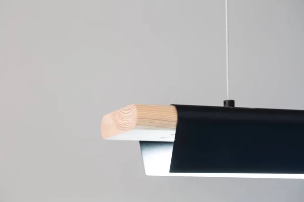 Hanging luminous wooden-metallic lamp — Stock Photo, Image