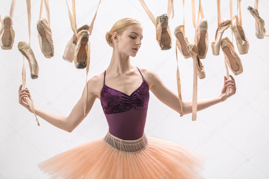 Blonde ballerina and pointe shoes