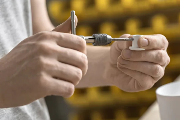 Man using wrench in workshop — Stock Photo, Image