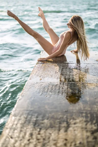 Ballerina posing on seafront — Stock Photo, Image