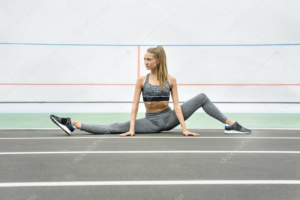 Sportive girl training outdoors