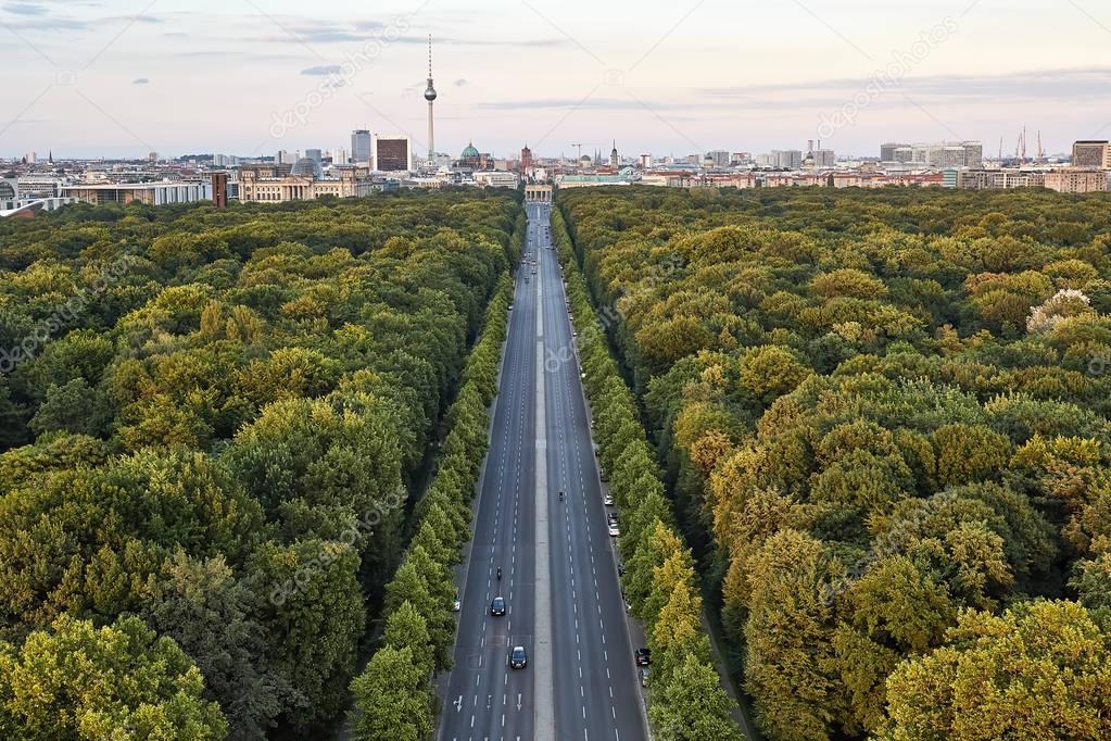 Highway between green trees in Berlin