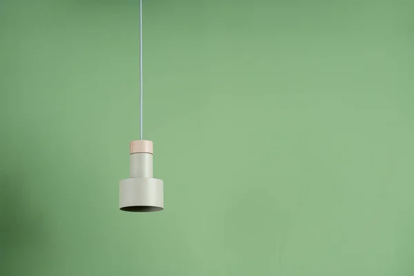 Hanging metal beige lamp with wooden part — Stock Photo, Image