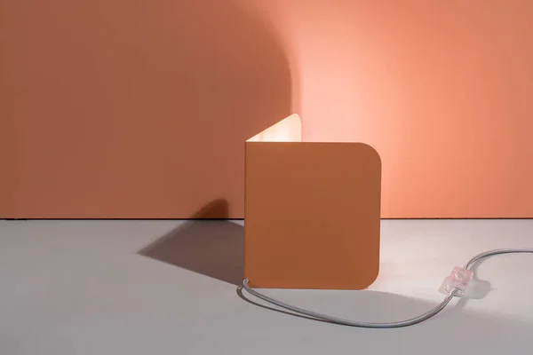 Illuminated metal orange lamp — Stock Photo, Image