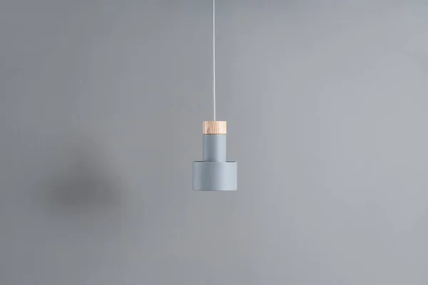 Hanging metal gray lamp with wooden part — Stock Photo, Image